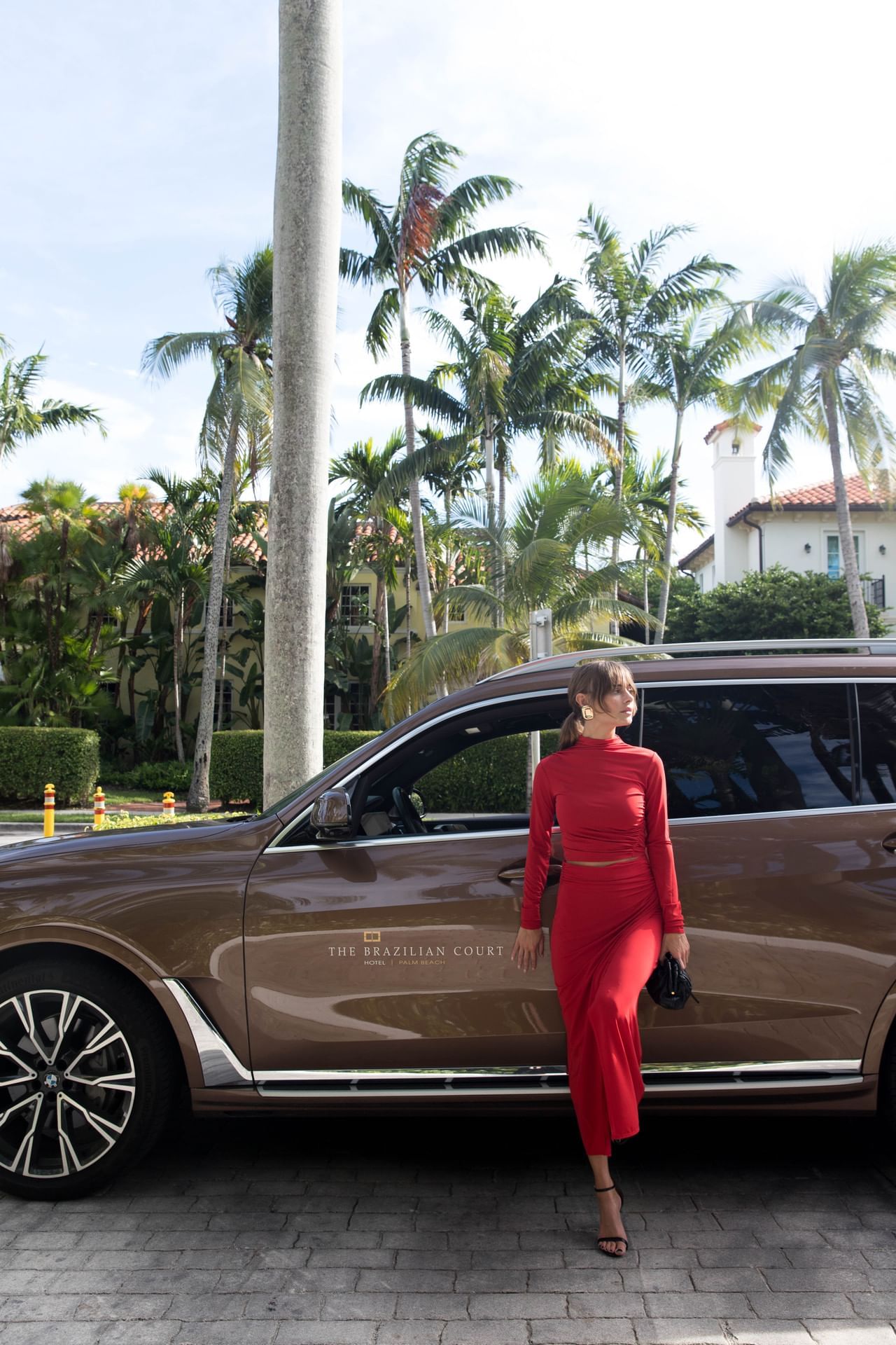 A girl arriving by a car at Brazilian Court
