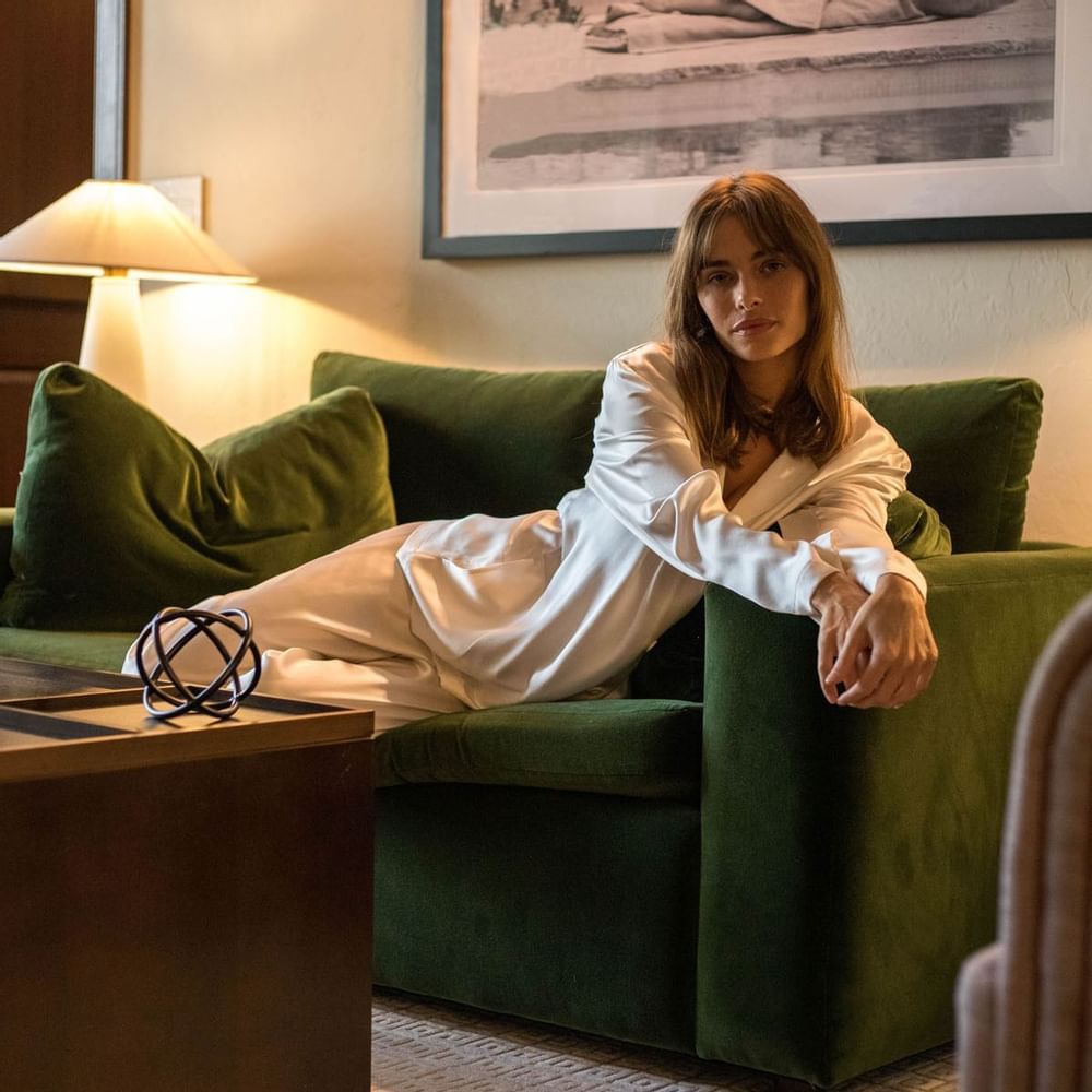 A couple having breakfast on bed at Brazilian Court