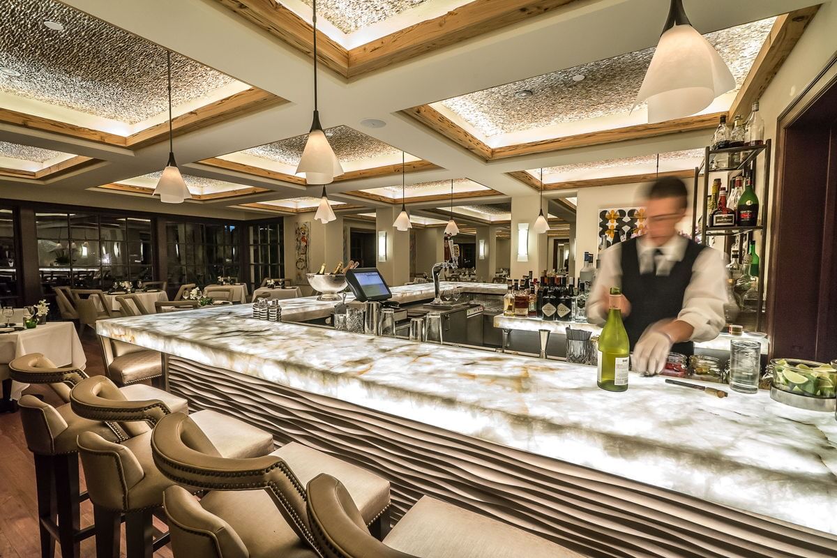 Interior of Boulud Bar with barman at Brazilian Court